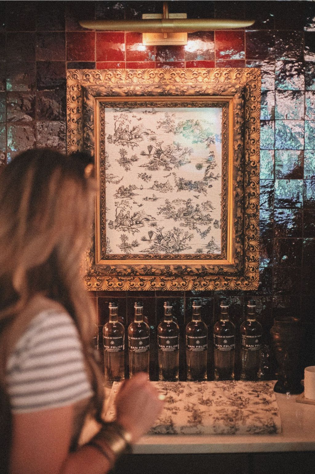 Ornate framed artwork on display inside a boutique shop in Greenville, South Carolina